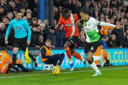 Elijah Adebayo on his way past Liverpool’s captain