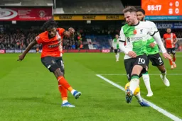 Issa Kabore sends his cross through the legs of Argentinian Alexis Mac Allister