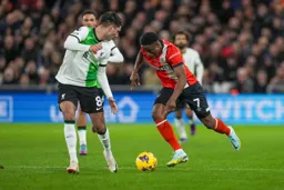 Chiedozie Ogbene taking on the defender