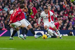 Carlton Morris tries to weave his way through