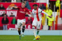 Issa Kabore holds off his man