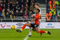 Jacob Brown slides the ball in