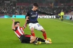 Ryan Giles tackled by the Bees skipper