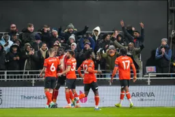 Elijah Adebayo is congratulated on his goal