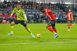 Elijah Adebayo jockeyed by Saliba