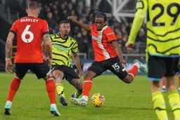 Teden Mengi strikes the ball with venom