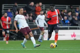 Elijah Adebayo skips away from Nathan Ake