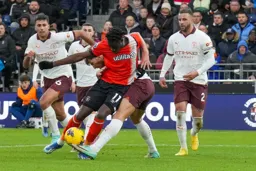 Elijah Adebayo surrounded