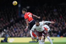 Jacob Brown heads the ball on