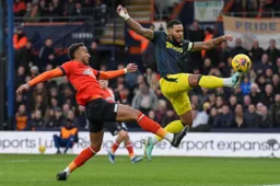 Jacob Brown is beaten to the ball