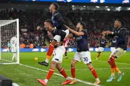 Town celebrating winning own goal