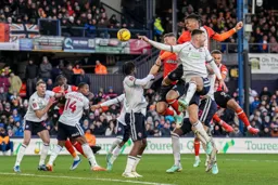 Gabriel Osho fires a header towards goal