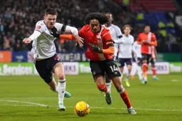 Tahith Chong holds off the defender on his way to scoring Town’s first