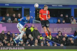Alfie Doughty tries to head the ball without looking