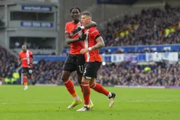 Ross Barkley congratulated by Elijah Adebayo after his effort is deflected into the Everton net for an own goal