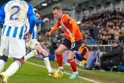 Cauley Woodrow holding the ball on the line