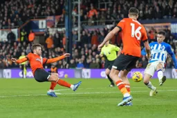 Jordan Clark still gets a shot in as he is about to fall