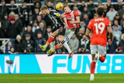 Reece Burke gets his head to the ball
