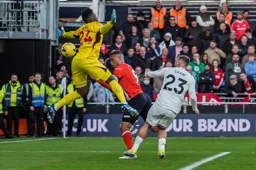 Carlton Morris heads through