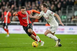 Carlton Morris looks to challenge United’s Johnny Evans