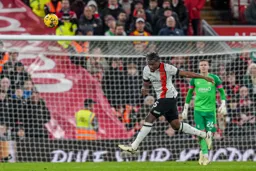 Teden Mengi powers a header away from the Town goal