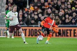 Amari’i Bell passes the ball past Kevin De Bruyne