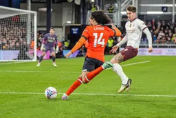 Tahith Chong gets to the ball ahead of England defender John Stones