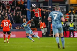 Teden Mengi gets a great defensive header away