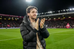 Tom Lockyer applauds all four corners of the ground
