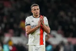 Carlton Morris applauds the faithful