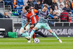 Albert Lokonga tries to hold onto the ball