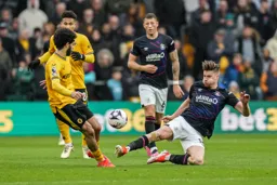 Reece Burke with a strong challenge