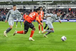 Fred Onyedinma takes on Ashley Young