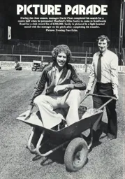 Mike Saxby in a wheelbarrow Programme Article 1979