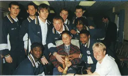 Kelvin Davis, Paul McLaren, Graham Alexander, Gary Waddock, Gary Doherty, Steve Davis, Gavin McGowan, Marvin Johnson, Dwight Marshall and David Oldfield with the World Cup - 97:98 programme feature