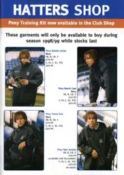 Liam George showing off all the coats you can get at the Club shop - 98:99 programme feature